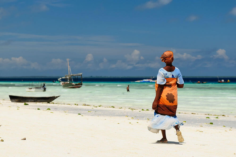 Ethnic women on the beautiful beach on the  Zanzibar island, Tanzania, Africa