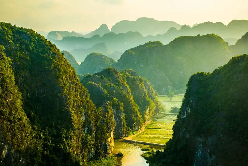 Beautiful sunset landscape viewpoint from the top of Mua Cave mountain, Ninh Binh, Tam Coc in Vietnam