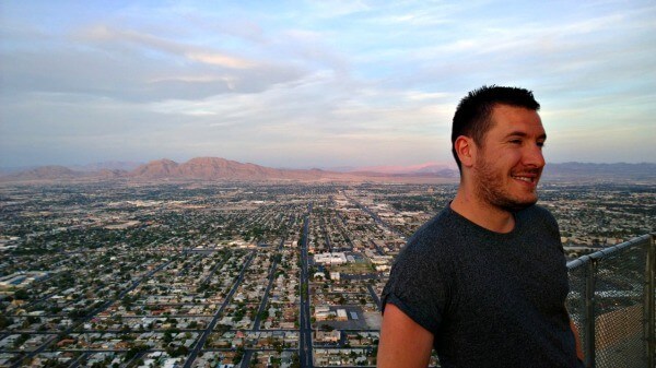 View at the top of the Stratosphere Hotel in Las Vegas, Nevada. The very  top of the tower, the 'Big Shot' ride, is pictured against a blue cloudy  sky. Copy space on