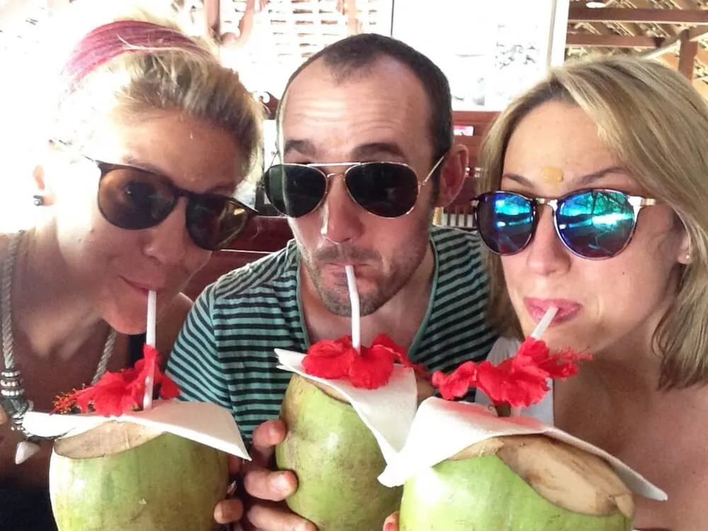 Us eating coconuts at Marari Beach Resort