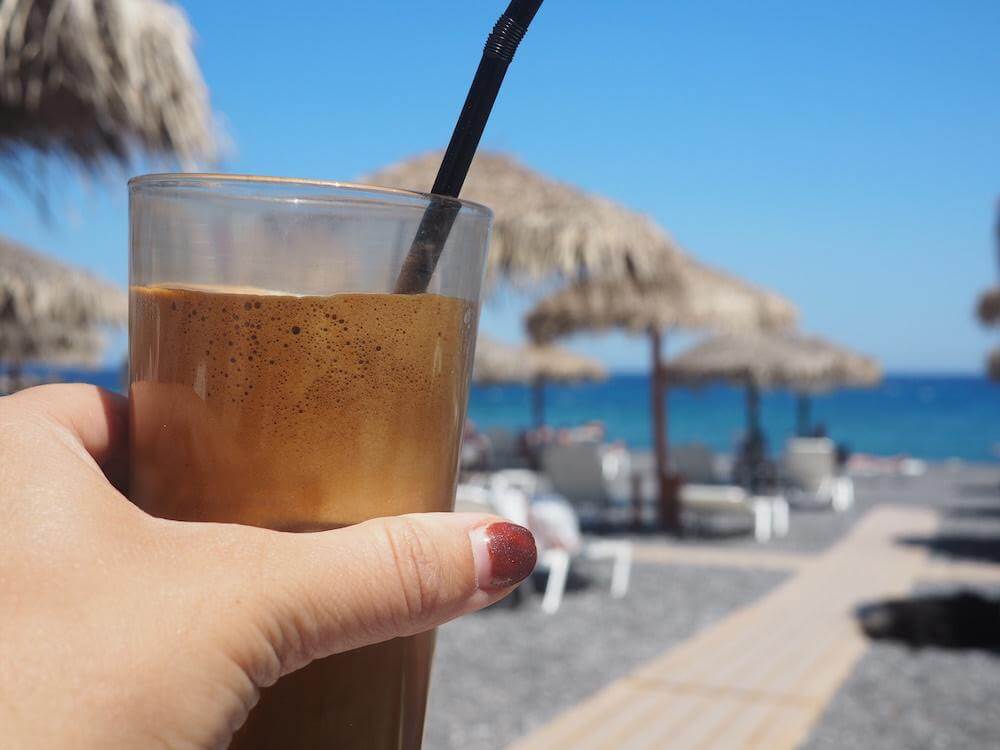 Coffee on the beach in Santorini
