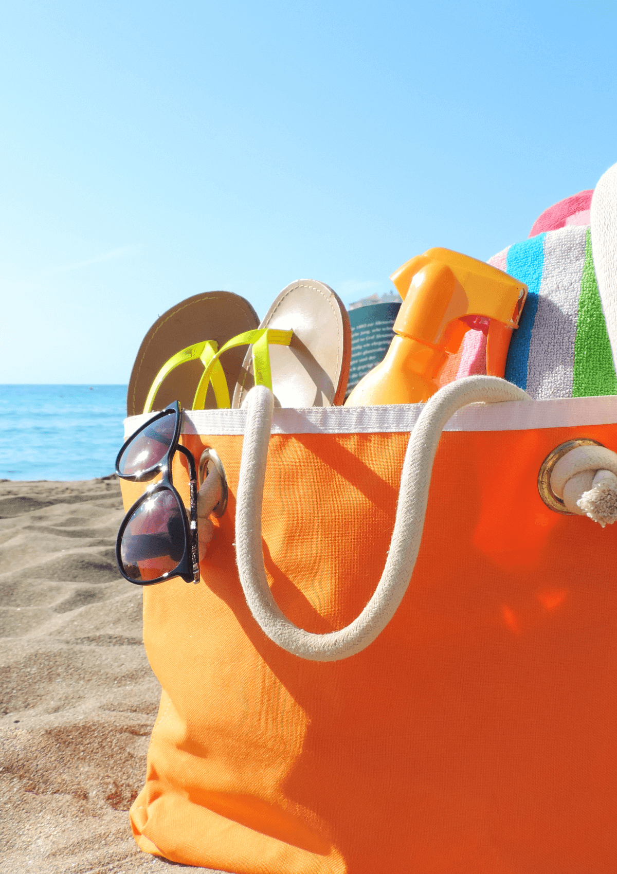 use a beach bag to pack items for a family day out at the seaside