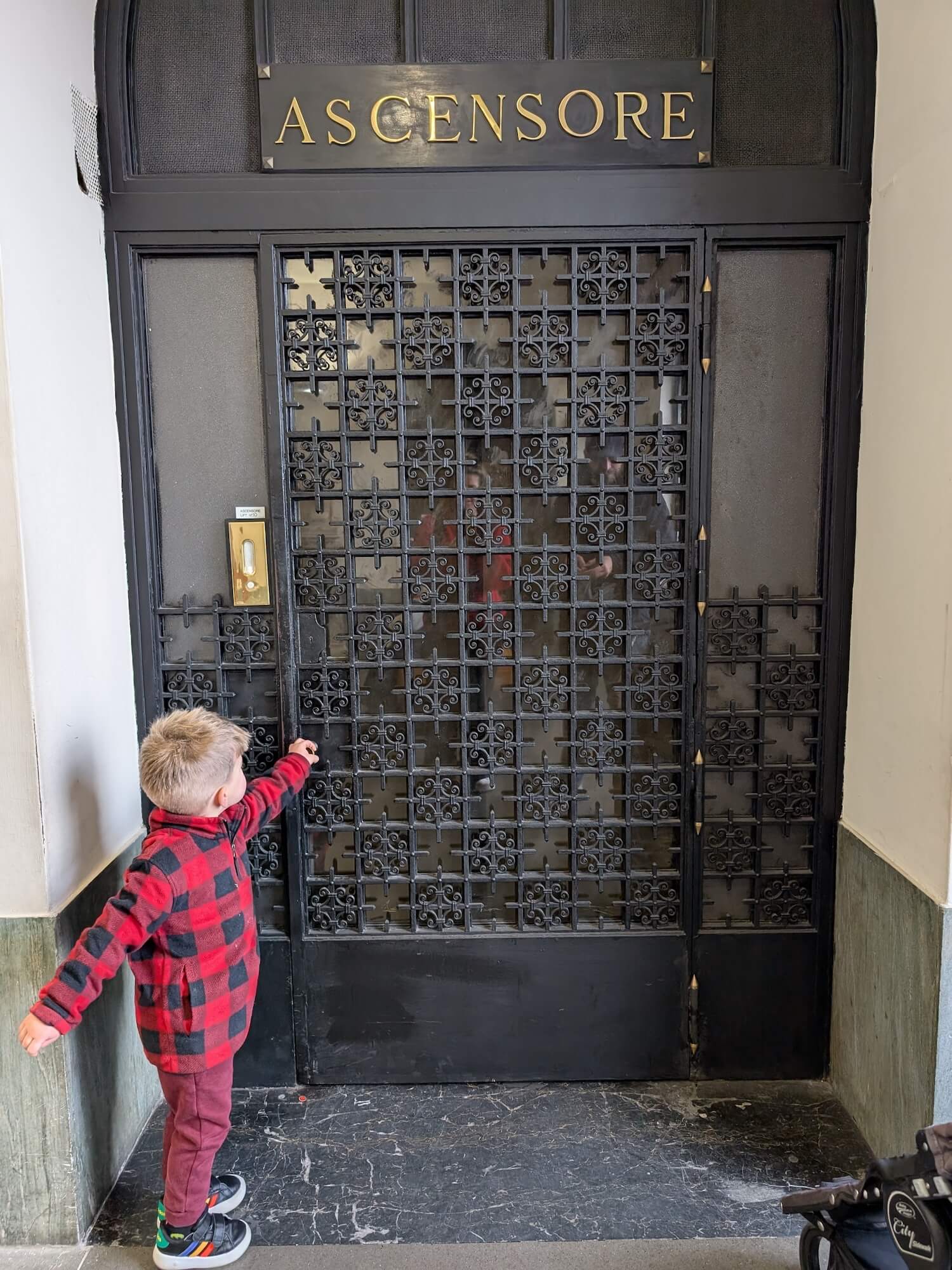 Reggie standing outside the lift at The Vatican