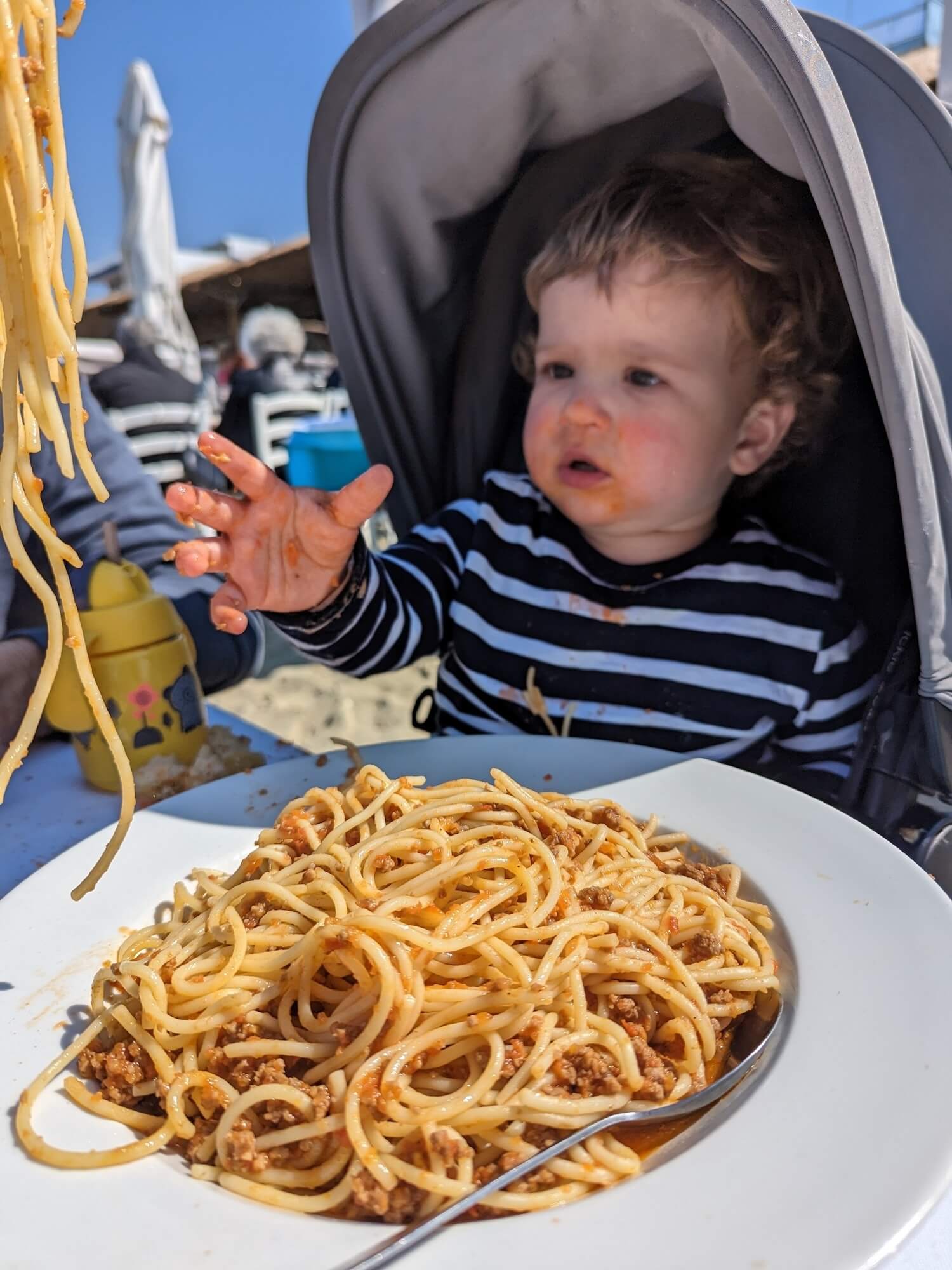 Eating spaghetti in greece