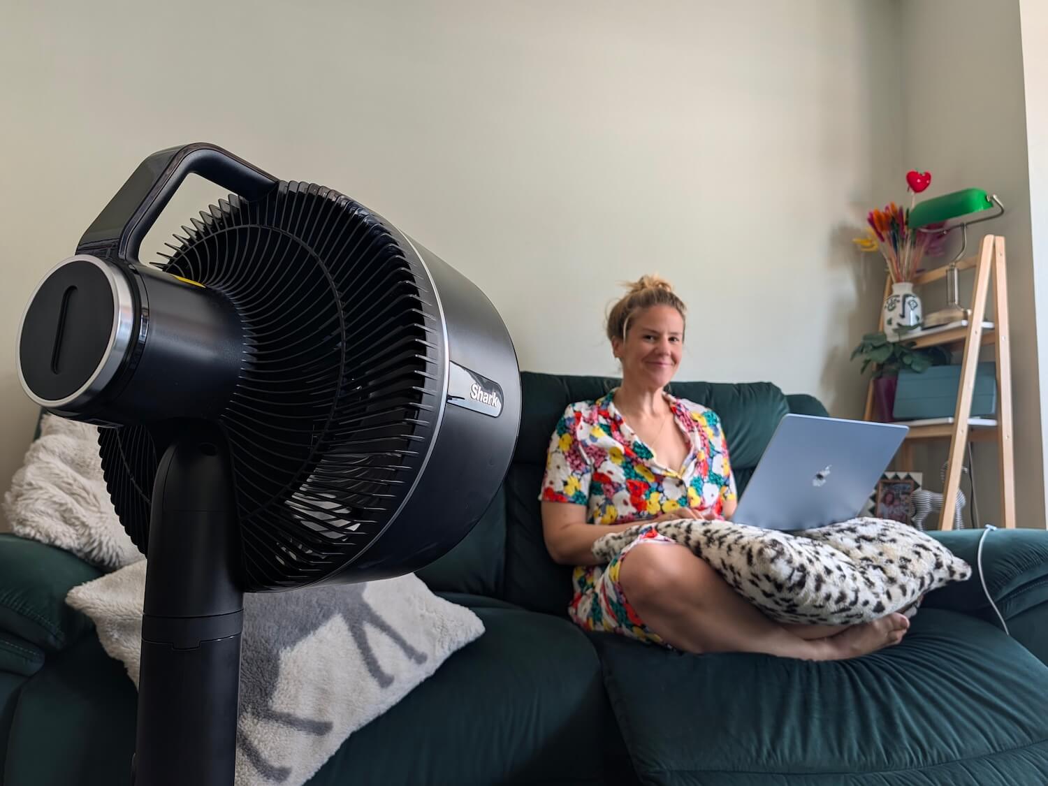 me sitting on the sofa with a fan