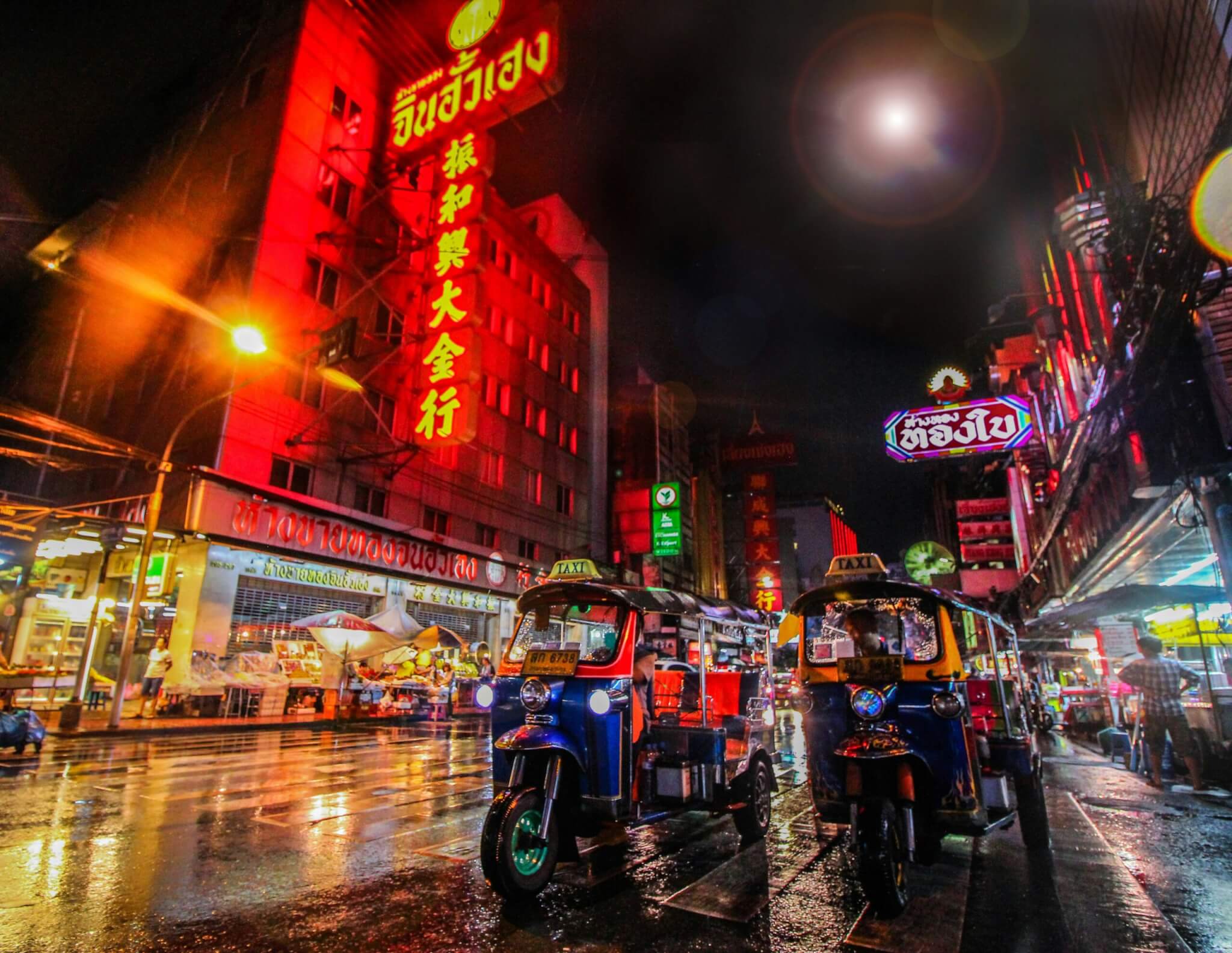 A busy Bangkok street market at night